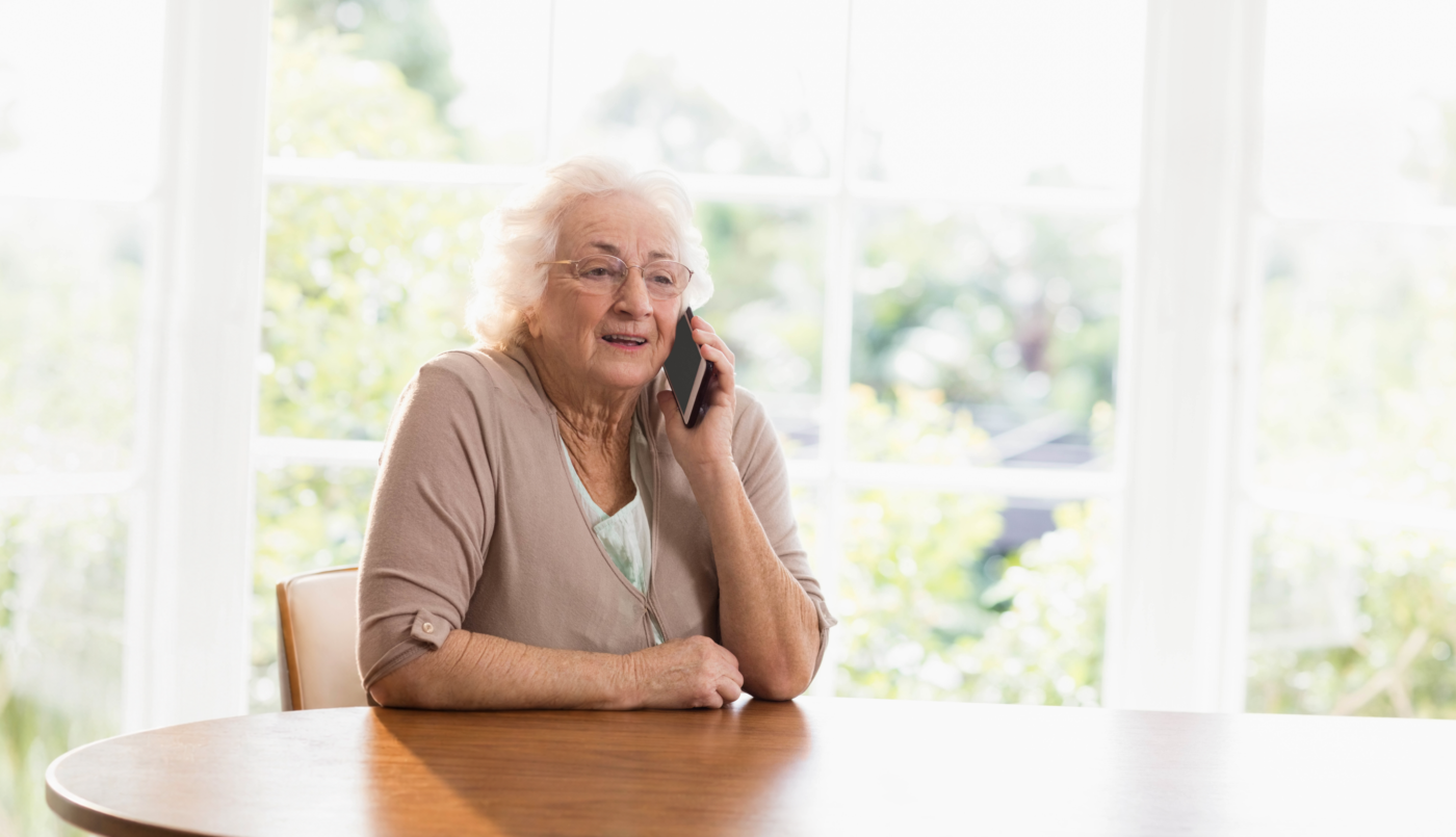 Woman on the phone arranging a prepaid cremation