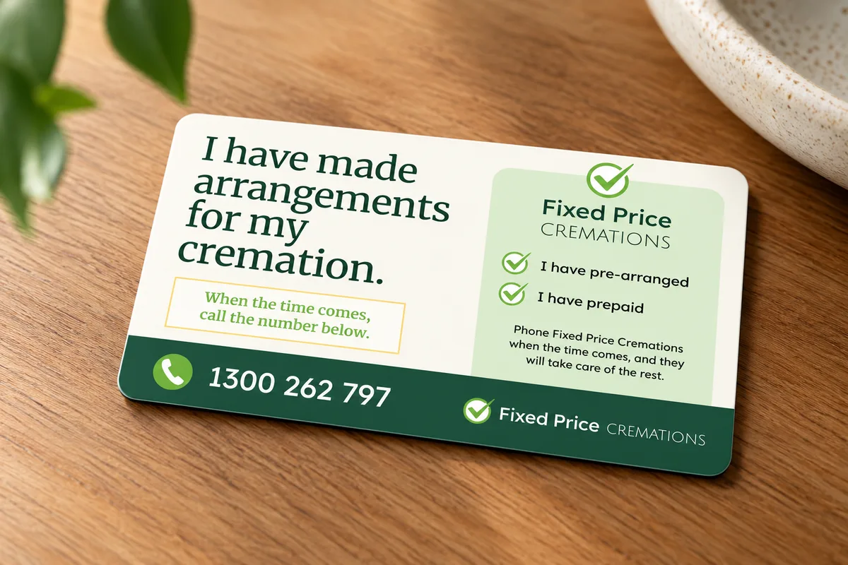 Fixed Price Cremations wallet card on a wooden table reading: I have made arrangements for my cremation